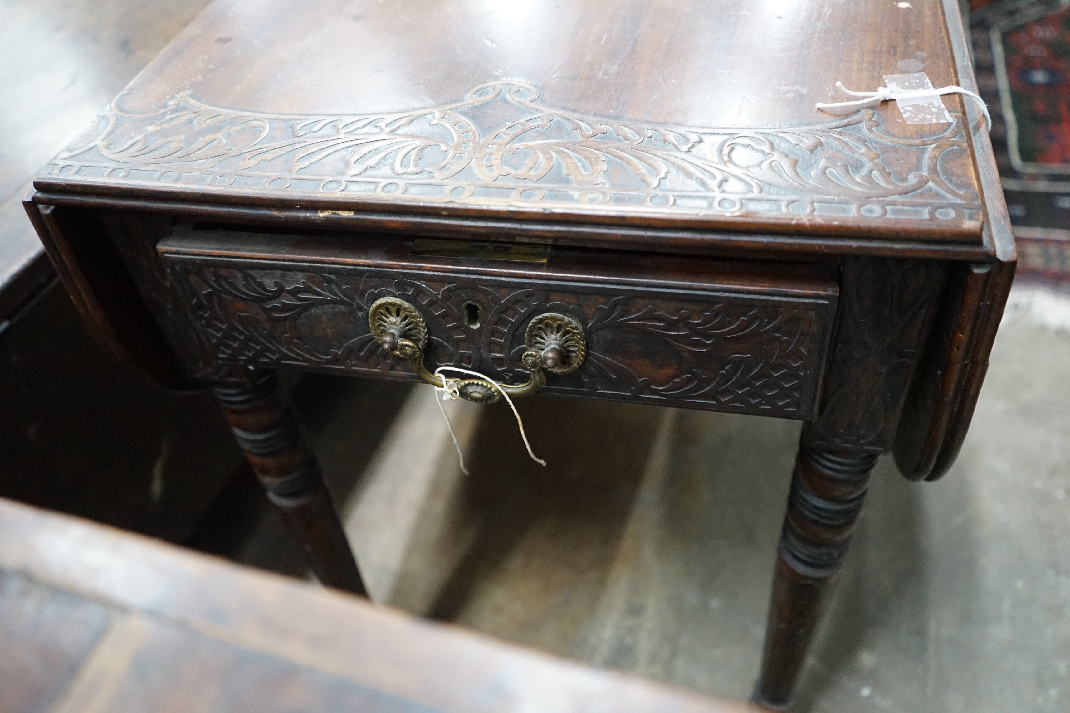 A Regency mahogany Pembroke table, later carved, width 89cms, depth 47cms, height 66cms.